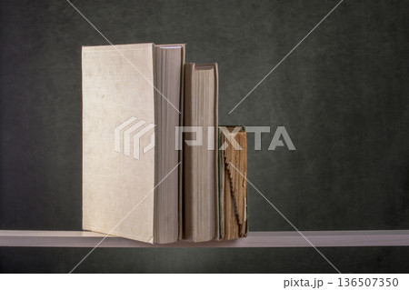 Still life with old books on a shelf 136507350