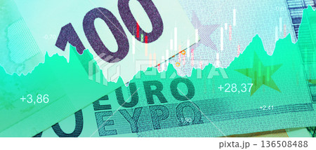 Euro banknotes and a stock market chart show financial trends and values in 2023 136508488