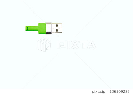 Green usb plug for connection on white 136509285
