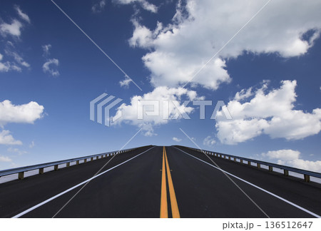 Road lines, clouds and sky in florida 136512647