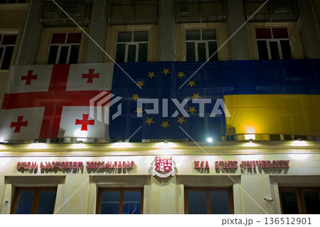 Ilia State University ISU building decorated with Georgian, EU and Ukrainian flags in Tbilisi, Georgia 136512901