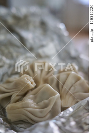 Close-up of Khinkali steamed Georgian dumplings on foil Close-up of Khinkali steamed Georgian dumplings on foil 136513226