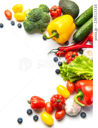 Fresh vibrant vegetables and fruits creating healthy eating border 136513316