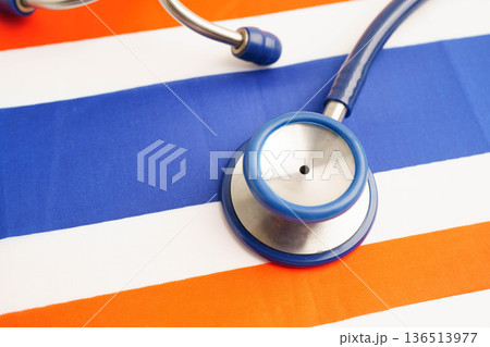 Thailand flag with black stethoscope, Business and finance concept. Thailand flag with black stethoscope, Business and finance concept. 136513977