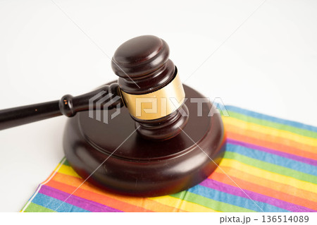 Gavel for judge lawyer on rainbow flag, symbol of LGBT pride month. 136514089