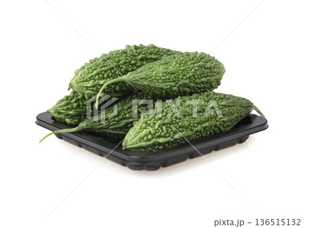 Fresh bitter gourd Bitter cucumber or bitter melon with cut slice isolated on a white background. 136515132