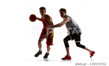 Basketball players sprinting in competitive one on one action isolated on white background Basketball players sprinting in competitive one on one action isolated on white background 136515332