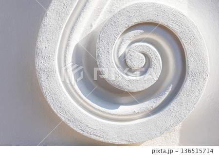 A close-up photography of a carved white decorative spiral 136515714