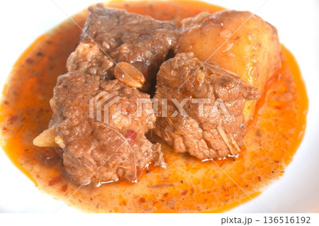 beef curry or Mussamun Indian food with slice potato on plate  136516192