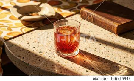 Refreshing Negroni Cocktail Held Over Mediterranean Sea View 136516948