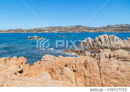 Rocky seaside landscape with bright blue water and natural stone formations. Travel and nature background, Sardinian, La Maddalena, Italy 136517752