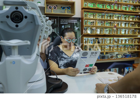 Phoropter for eye test, lenses glasses for eye check in optical store. Phoropter for eye test, lenses glasses for eye check in optical store. 136518178