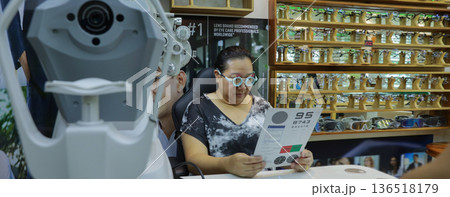 Phoropter for eye test, lenses glasses for eye check in optical store. Phoropter for eye test, lenses glasses for eye check in optical store. 136518179