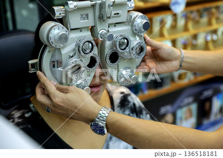 Phoropter for eye test, lenses glasses for eye check in optical store. Phoropter for eye test, lenses glasses for eye check in optical store. 136518181