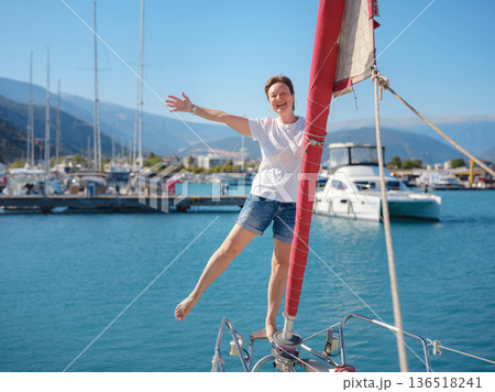 Woman Sailor Handling Sails Preparing For Navigation In Sea 136518241