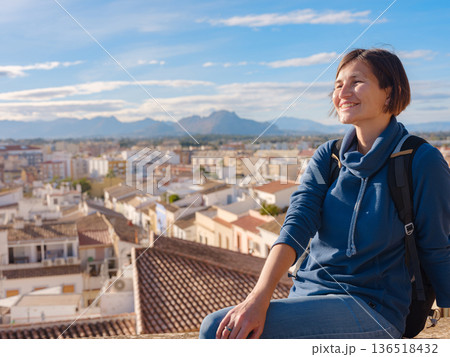 Young woman exploring historic castle in Denia Young woman exploring historic castle in Denia 136518432
