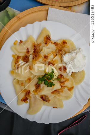 Top View Ukrainian Vareniki with Fried Onions on Plate Top View Ukrainian Vareniki with Fried Onions on Plate 136518498