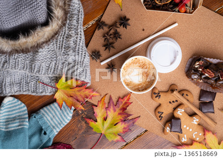 autumn cozy and warm composition with coffee at wooden table with leaves. life style concept. flat lay autumn cozy and warm composition with coffee at wooden table with leaves. life style concept. flat lay 136518669