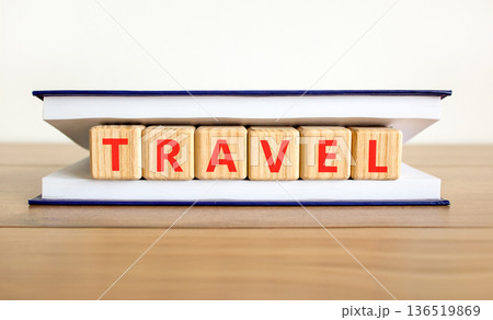 Travel traveling touristic word symbol. Concept word Travel on beautiful wooden blocks in book. Beautiful wooden table white background. Business travel traveling touristic word concept. Copy space. Travel traveling touristic word symbol. Concept word Travel on beautiful wooden blocks in book. Beautiful wooden table white background. Business travel traveling touristic word concept. Copy space. 136519869