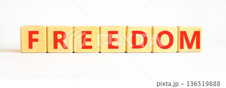 Freedom support symbol. Concept word Freedom on beautiful wooden blocks. Beautiful white background. Business freedom support concept. Copy space. 136519888