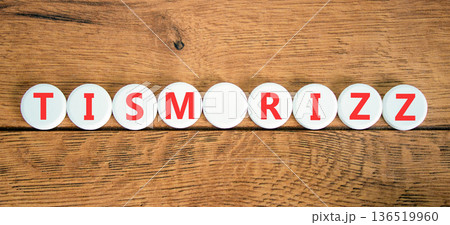 Tism rizz symbol. Concept word Tism rizz on beautiful white circles. Beautiful wooden background. Business education support tism rizz concept. Copy space. 136519960