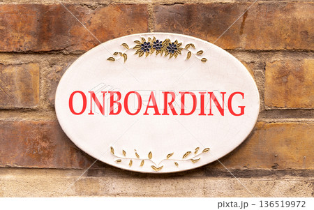 Onboarding success symbol. Concept word Onboarding on beautiful white marble sign plate. Beautiful ancient brick wall background. Business onboarding success concept. Copy space. Onboarding success symbol. Concept word Onboarding on beautiful white marble sign plate. Beautiful ancient brick wall background. Business onboarding success concept. Copy space. 136519972