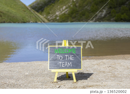 Support, help welcome to the team symbol. Concept words Welcome to the team on beautiful blackboard. Beautiful mountain lake background. Business welcome to the team concept. Copy space. 136520002