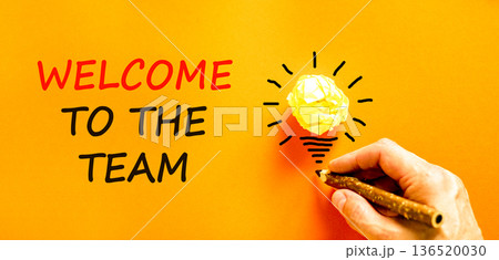 Support, help welcome to the team symbol. Concept words Welcome to the team on beautiful paper. Beautiful orange background. Businessman's hand. Business welcome to the team concept. Copy space. Support, help welcome to the team symbol. Concept words Welcome to the team on beautiful paper. Beautiful orange background. Businessman's hand. Business welcome to the team concept. Copy space. 136520030