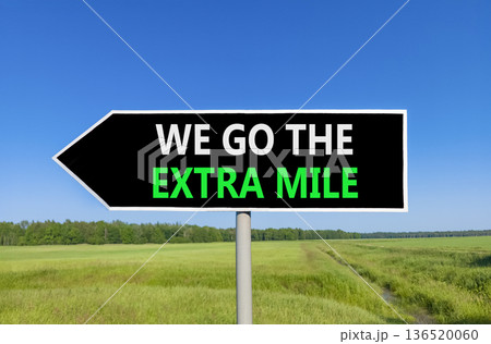 Support, help we go the extra mile symbol. Concept words We go the extra mile on beautiful black road sign. Beautiful blue sky green field background. Business we go the extra mile concept Copy space Support, help we go the extra mile symbol. Concept words We go the extra mile on beautiful black road sign. Beautiful blue sky green field background. Business we go the extra mile concept Copy space 136520060