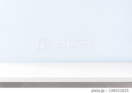 White table against blue wall White table against blue wall 136521025