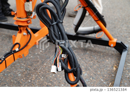 Spiral cable connecting truck cabin and trailer. Pneumatic hoses and electric cables 136521384