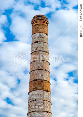 brick industrial chimney on sky background brick industrial chimney on sky background 136522586