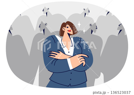Woman leader feels confident and crosses arms in front chest, standing near crowd of faceless people 136523037