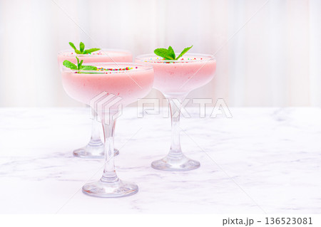 fruit mousse, made from jelly and cottage cheese, in glasses, decorated with sprinkles and mint, homemade 136523081