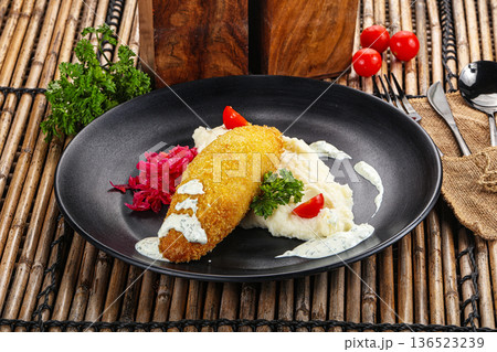 Chicken Kiev cutlet with puree 136523239