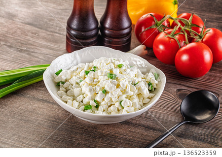 Cottage cheese with green onion Cottage cheese with green onion 136523359