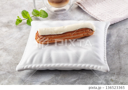 White vanilla eclair with icing White vanilla eclair with icing 136523365