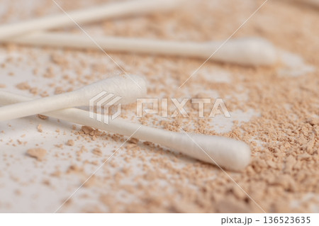 old scattered broken cosmetics, makeup powder , dust and small and large pieces of women's cosmetics that were broken and ruined, close up 136523635