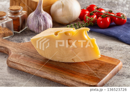 Yellow maasdam cheese triangle piece Yellow maasdam cheese triangle piece 136523726