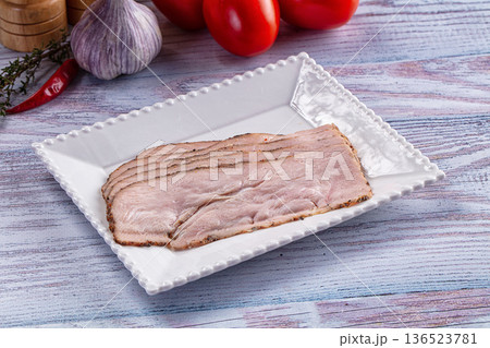 Sliced Pastrami meat fillet with spices Sliced Pastrami meat fillet with spices 136523781