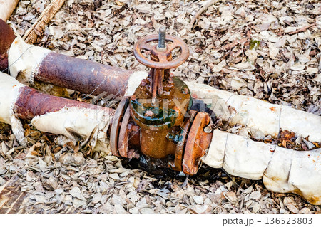 rusty leaky valve on the water pipes rusty leaky valve on the water pipes 136523803