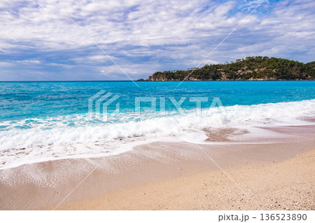 sandy coast and turquoise water in the sea sandy coast and turquoise water in the sea 136523890