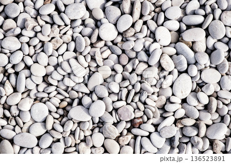 background of pebbles on the beach, top view, close-up background of pebbles on the beach, top view, close-up 136523891