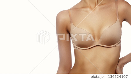 Beautiful part of female body. Spa, wellbeing and healthcare. Breast care. Perfect woman form, flat belly, sexy breasts in beige bra lingerie. Healthy lifestyle, smooth skin, diet, sport. Women Health Beautiful part of female body. Spa, wellbeing and healthcare. Breast care. Perfect woman form, flat belly, sexy breasts in beige bra lingerie. Healthy lifestyle, smooth skin, diet, sport. Women Health 136524107