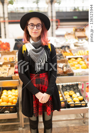 Young woman shopping fresh groceries in a market Young woman shopping fresh groceries in a market 136525944
