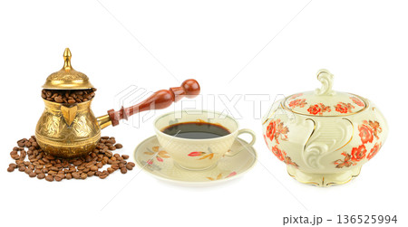 Traditional coffee set with brass cezve, porcelain cup, and sugar bowl Traditional coffee set with brass cezve, porcelain cup, and sugar bowl 136525994