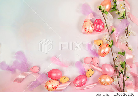 Happy Easter concept. Abstract spring Easter composition with pink painted eggs, feathers, butterflies, flowering branches and flowers. Banner for the screen with space for congratulatory text Happy Easter concept. Abstract spring Easter composition with pink painted eggs, feathers, butterflies, flowering branches and flowers. Banner for the screen with space for congratulatory text 136526216