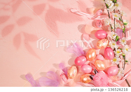 Happy Easter concept. Abstract spring Easter composition with pink painted eggs, feathers, butterflies, flowering branches and flowers. Banner for the screen with space for congratulatory text Happy Easter concept. Abstract spring Easter composition with pink painted eggs, feathers, butterflies, flowering branches and flowers. Banner for the screen with space for congratulatory text 136526218