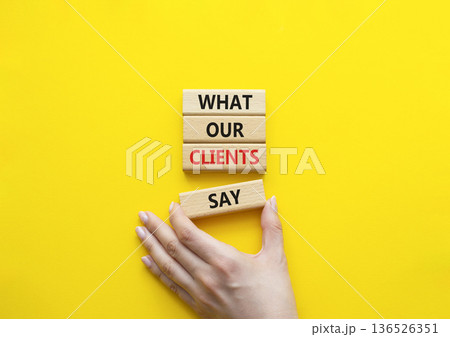 Clients symbol. Concept words What our Clients Say on wooden blocks. Beautiful bright yellow background. Businessman hand. Business and What our Clients Say concept. Copy space. Clients symbol. Concept words What our Clients Say on wooden blocks. Beautiful bright yellow background. Businessman hand. Business and What our Clients Say concept. Copy space. 136526351