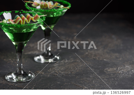 Green Cocktails with Rainbow Candy and Shamrocks. Festive St. Patricks Day Celebration Still Life Green Cocktails with Rainbow Candy and Shamrocks. Festive St. Patricks Day Celebration Still Life 136526997